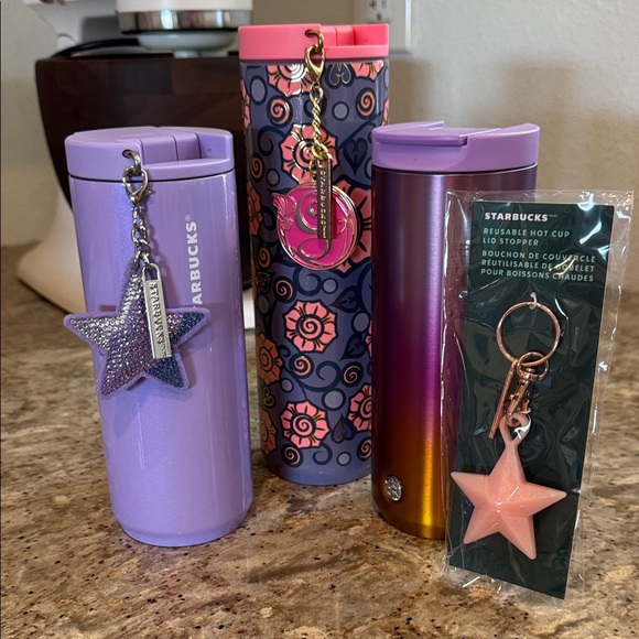 Starbucks Purple Star Wicked Glenda Rainbow tumbler and star drink stopper.